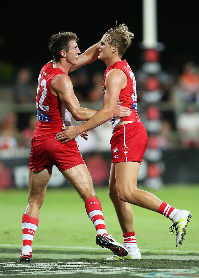 AFL 2016 NAB Challenge - Sydney v GWS Giants SYDNEY, AUSTRALIA - MARCH 04: Jordan Dawson of the Swans celebrates with team mate Dean Towers after kicking a super goal during the 2016 AFL NAB Challenge match between the Sydney Swans and the Greater Western Sydney Giants at Drummoyne Oval on March 4, 2016 in Sydney, Australia. (Photo by Brendon Thorne/AFL Media/Getty Images)